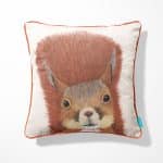 Squirrel cushion Call of the Wild with orange piping